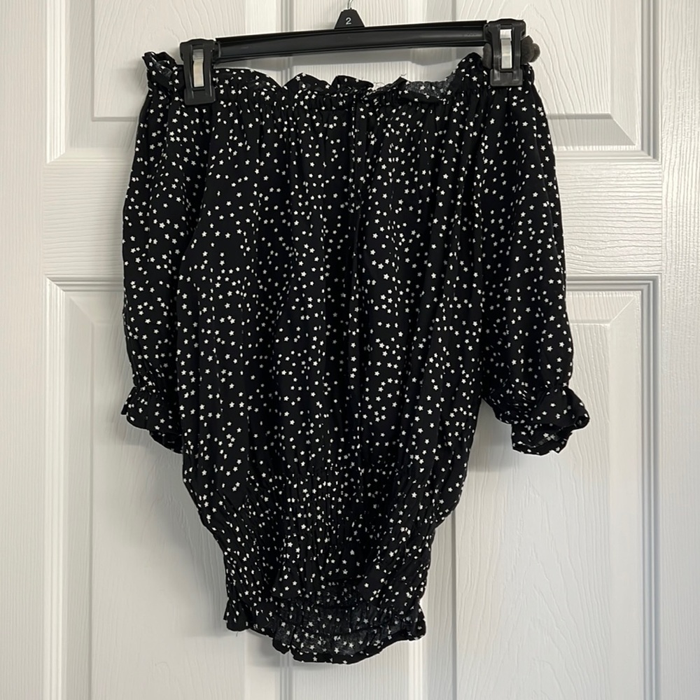 Black with white stars off the shoulder top